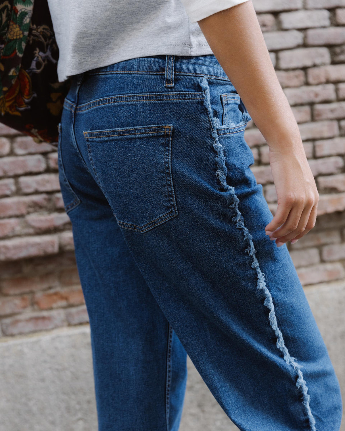 Blue Jeans with Frayed Side Seams