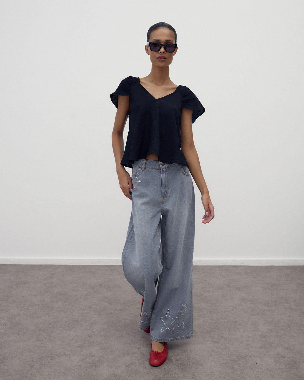 Jeans Tachas Estrelas Cinzento