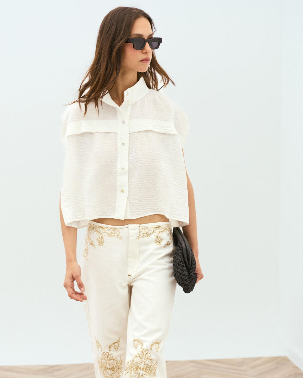 White Sleeveless Blouse with Shoulder Pads