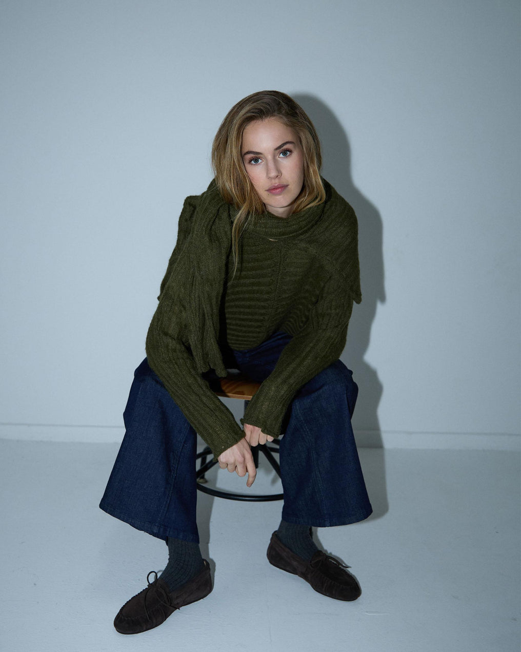 Costura em malha listrada verde-escura