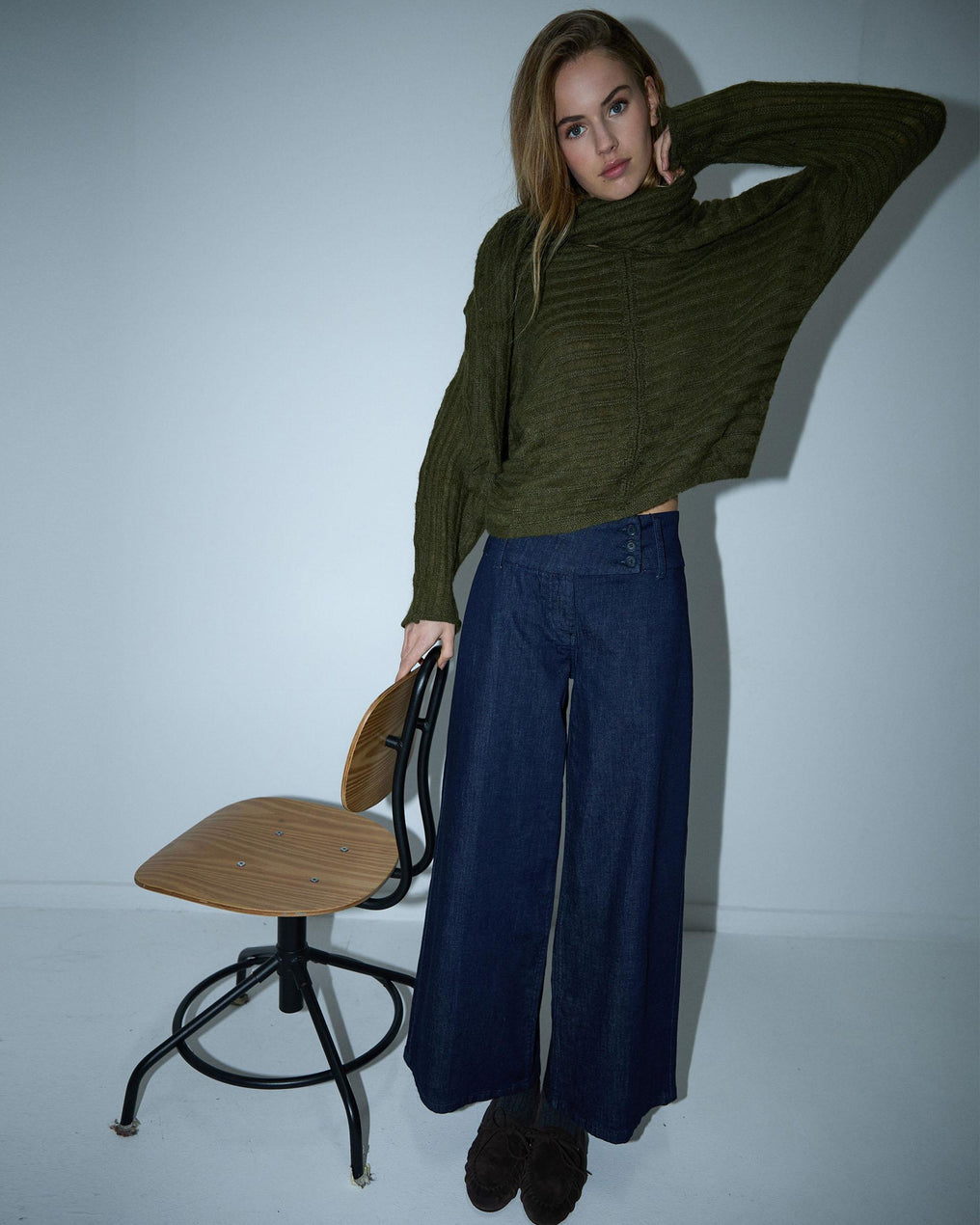 Costura em malha listrada verde-escura