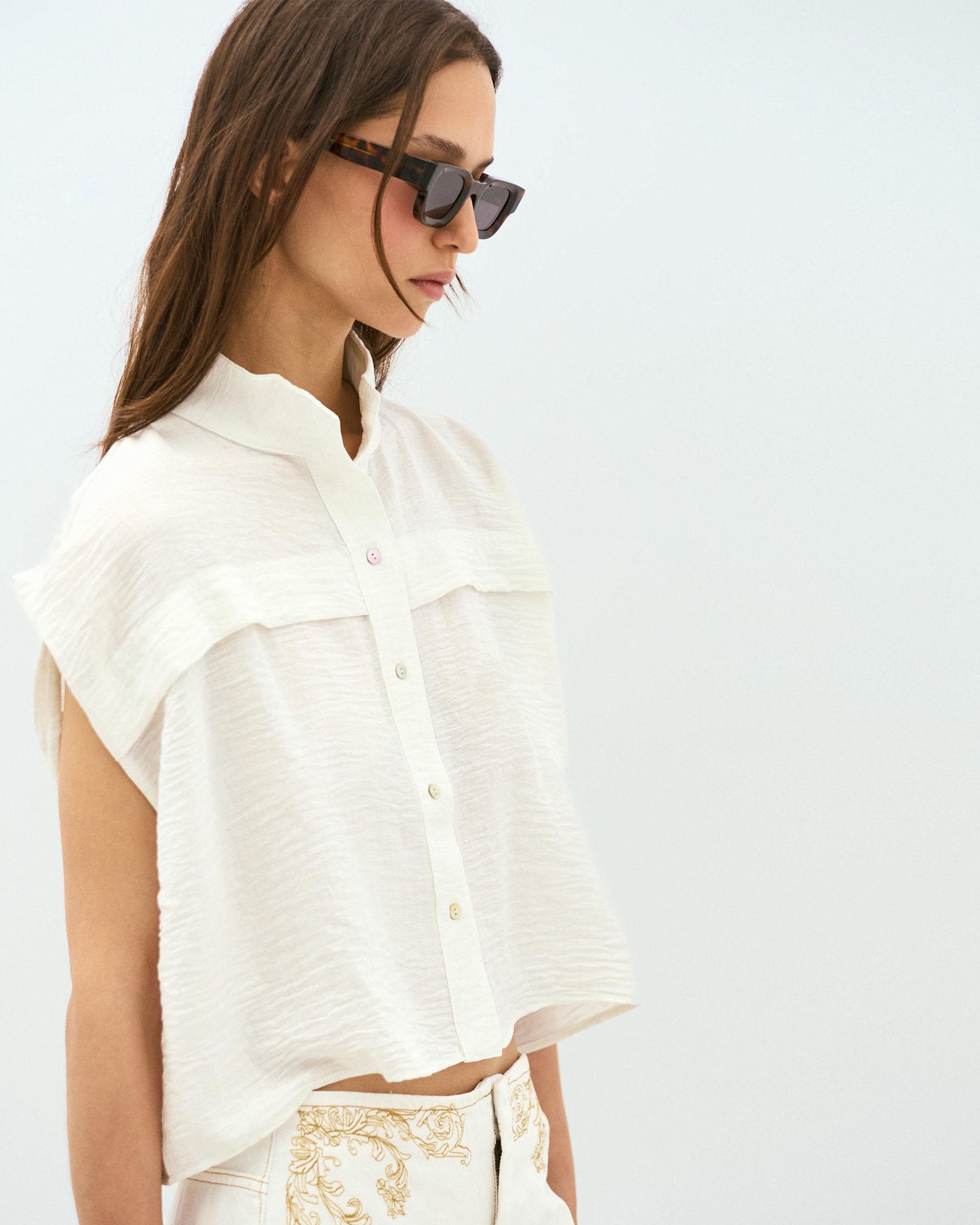 White Sleeveless Blouse with Shoulder Pads