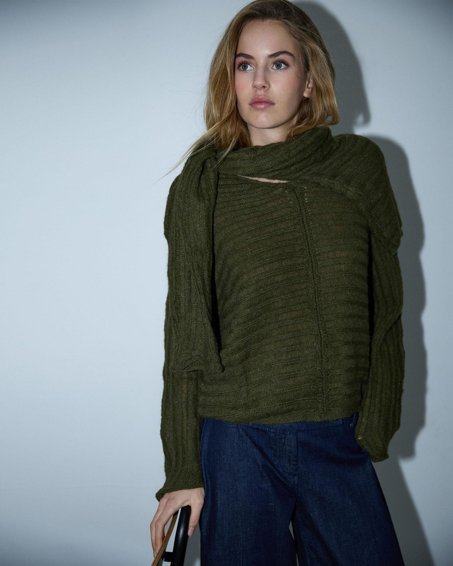 Costura em malha listrada verde-escura