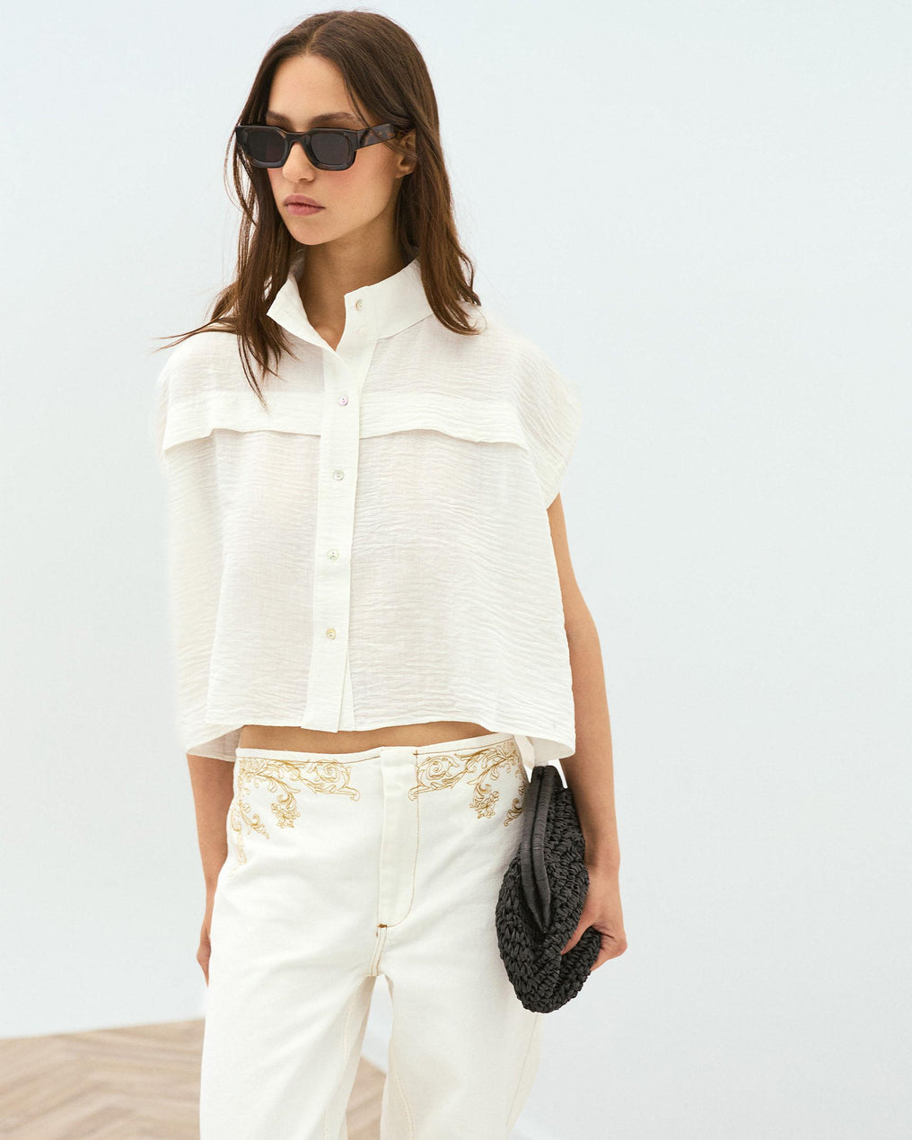 White Sleeveless Blouse with Shoulder Pads