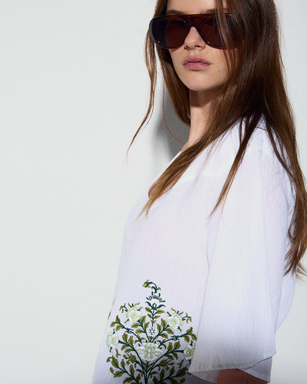 White Blouse with Floral Embroidery and V-Neck Yoke