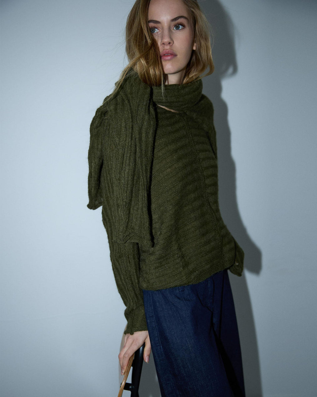 Costura em malha listrada verde-escura