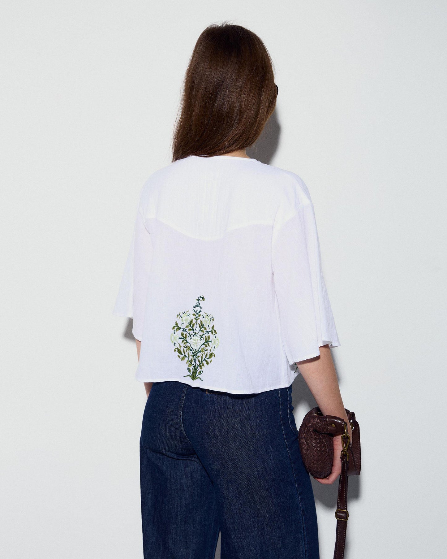 White Blouse with Floral Embroidery and V-Neck Yoke