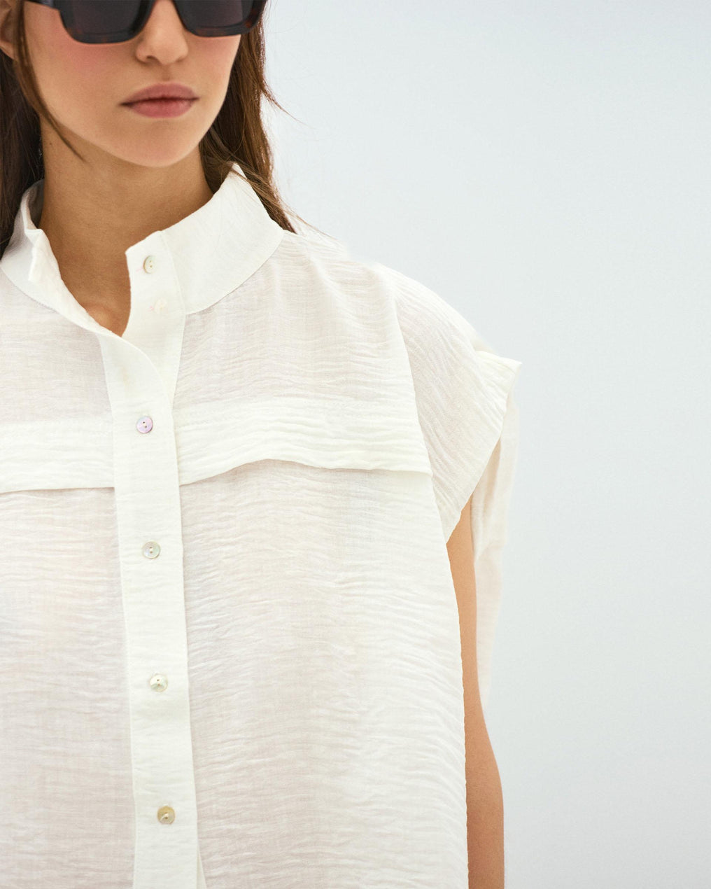 White Sleeveless Blouse with Shoulder Pads
