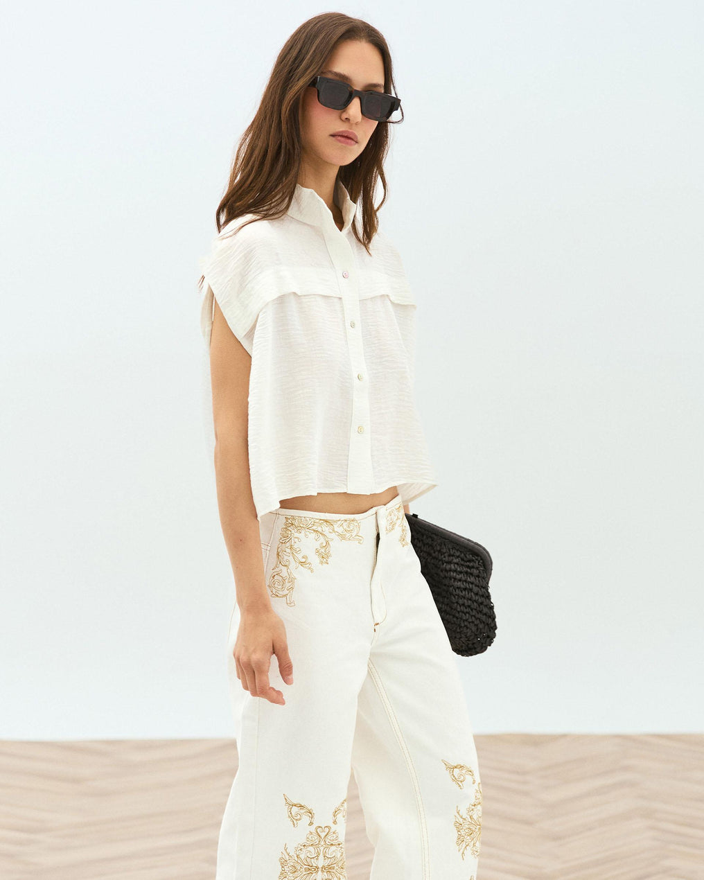 White Sleeveless Blouse with Shoulder Pads