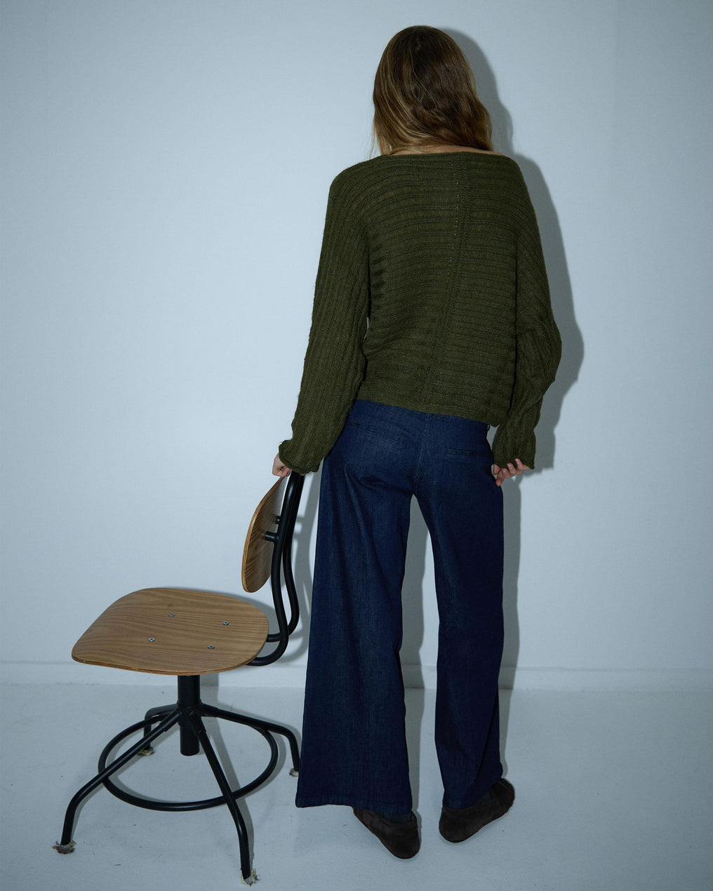 Costura em malha listrada verde-escura