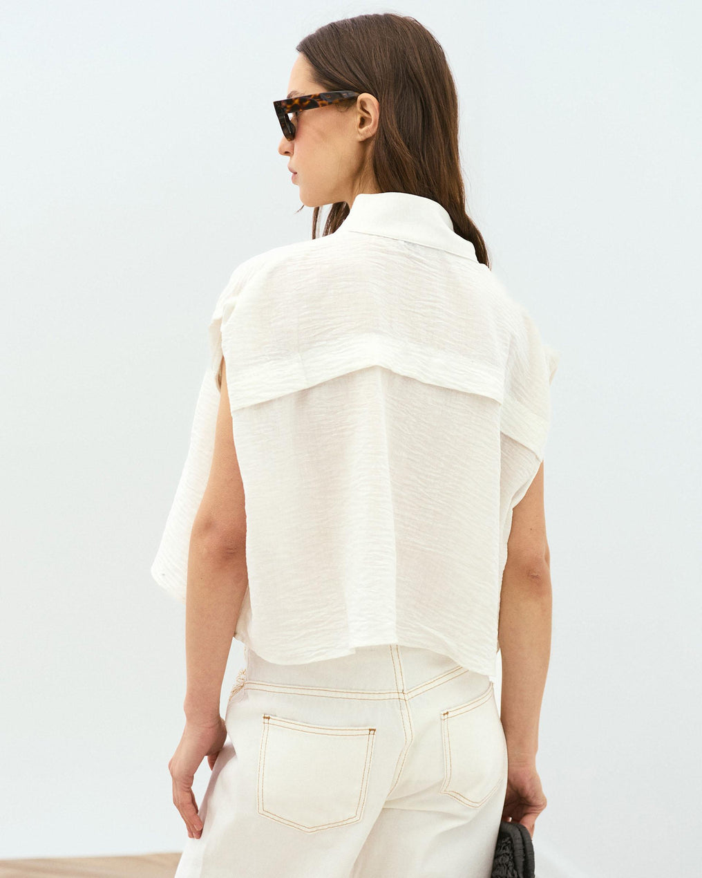 White Sleeveless Blouse with Shoulder Pads